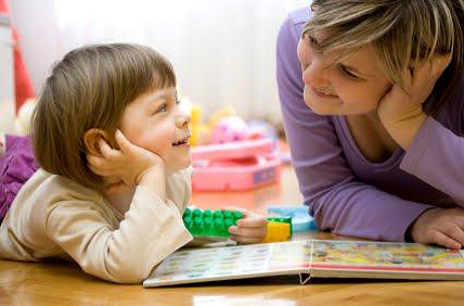 adult and child reading a book together